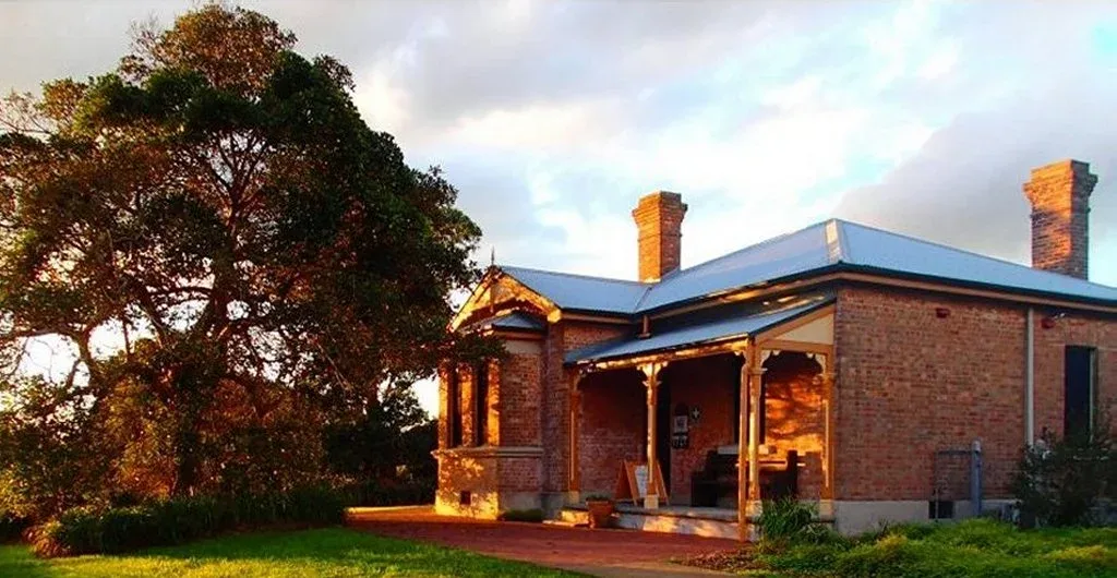 The Schoolmasters House verandah in golden evening light