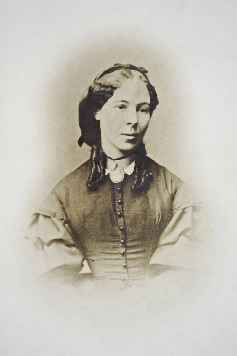 Sepia photographic portrait of Helena Scott wearing a locket on a ribbon