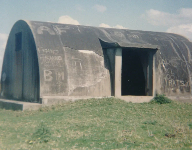 The igloo entrance with its concrete porch, graffiti partly cleaned